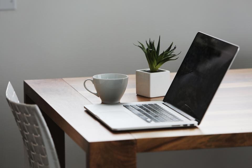 Laptop and coffee on a desk